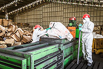 rent-a-drum workers sorting waste