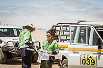 environmental field team taking borehole water sample