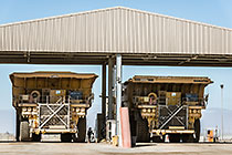 workers & 320 T trucks at diesel filling station