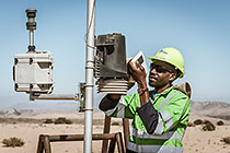 environmental monitoring assistant Immanual checking weather station