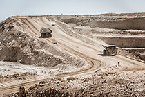 320 T trucks driving on pit access road