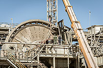 team & crane replacing core roll inside mill