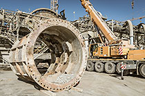 team & crane replacing core roll inside mill