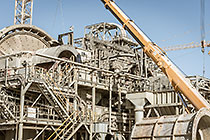 team & crane replacing core roll inside mill