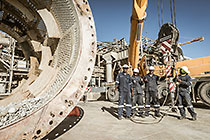 team & crane replacing core roll inside mill