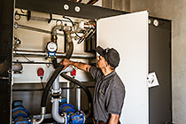 Jacques Van Wyk checking diesel generator