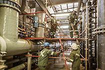 workers demantling scafolding in ultra filtration building