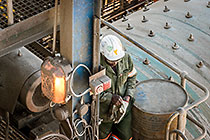 workers replacing layers inside rod mill
