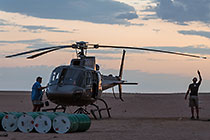 pilots checking helicopter before take-off