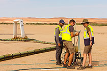 SkyTEM team checking rig before take-off
