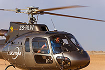 pilot in helicopter at take-off