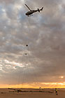 helicopter taking off with SkyTEM rig at sunrise