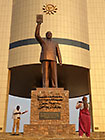 Elias & Lisa looking at Presidential statue in front of museum