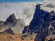 moonscape mountain peaks under clouds