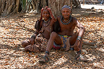 Himba people sitting under tree