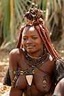 Himba girl sitting under tree