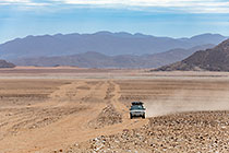 disco driving on track in plain & mountains