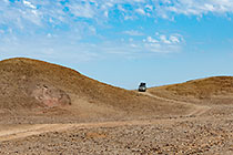 disco driving on rocky track