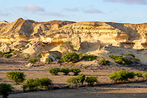 rock formation around dry lake