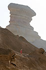 girl & dog walking on sandstone rock formation