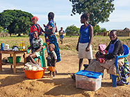 women selling bread & cookies along road