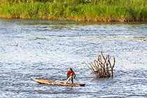 fisherman on boat in river