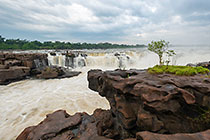 waterfall between rocks at sunrise