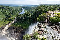 waterfall & river between green vegetation