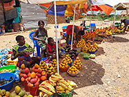 woman selling fruits along road