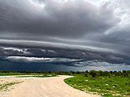 stormy clouds over gravel road