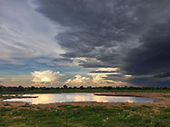 stormy clouds over waterhole