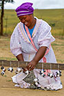 Zulu village : woman weaving mat