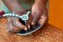 man making leather shoe