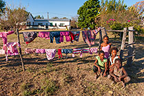 children playing near laundry line