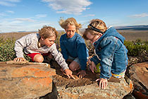 Enya, James & Lisa looking at fossils
