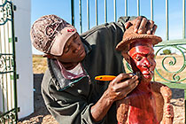 Malawi artist polishing wooden sculpture