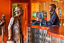 Blessing talking to Harry, the wooden sculpture