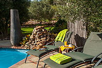 long chairs near swimming pool