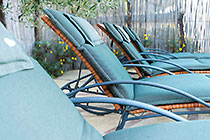 long chairs near swimming pool