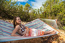young lady resting on hammock
